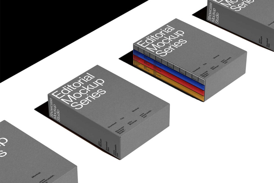 Multiple gray book mockups arranged in isometric view with colored spines visible