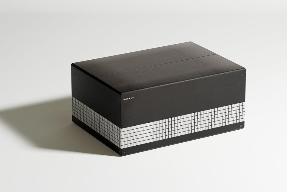 Black grid box mockup on white background for packaging design showcasing minimalist graphics and modern templates perfect for creative designers