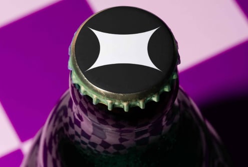 Bottle cap design with abstract black and white graphic pattern on a vibrant purple and pink background ideal for mockups or branding templates