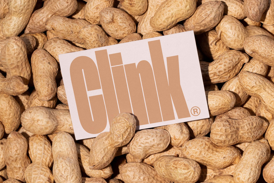Tan business card with Olink logo on peanut background