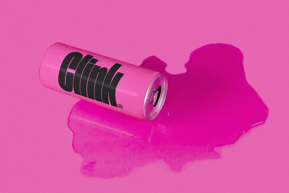Neon pink can with black striped design on gradient pink backdrop