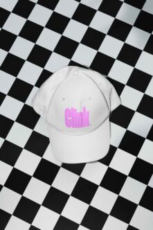White cap featuring pink embroidered text on black checkered pattern background