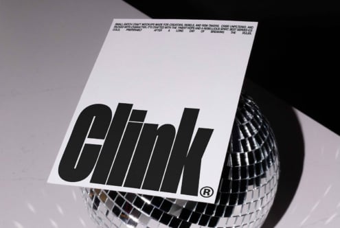 Minimalist mockup design featuring bold typography on a modern white card, placed against a reflective disco ball perfect for graphic designers.