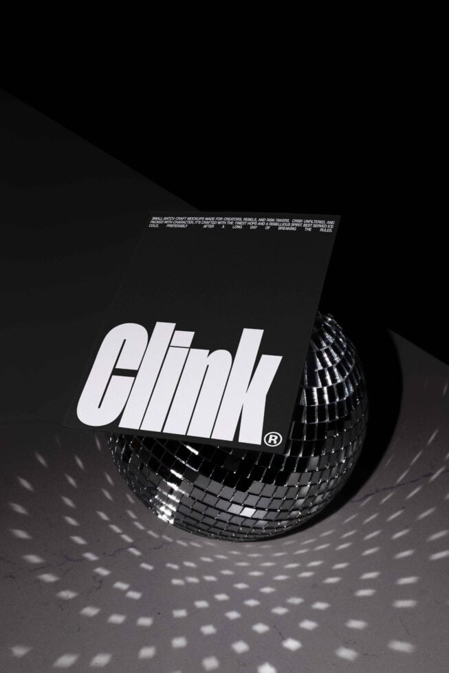 Modern graphic design mockup featuring bold Clink font on a black card, placed on a reflective disco ball, ideal for creative marketing assets.