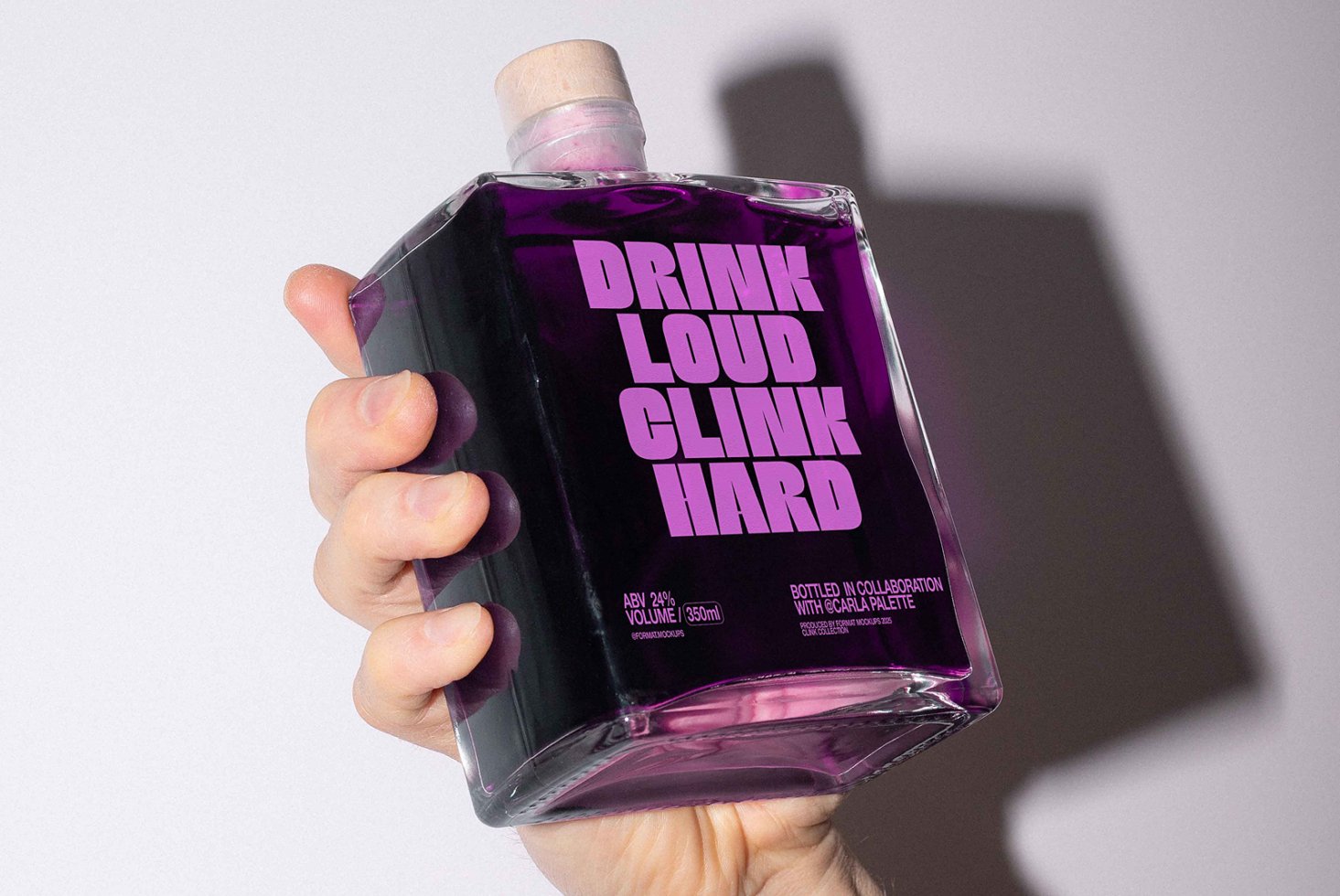 Hand holding a square bottle with purple liquid and bold typography. Perfect for packaging mockups, graphic design inspiration, and branding templates.