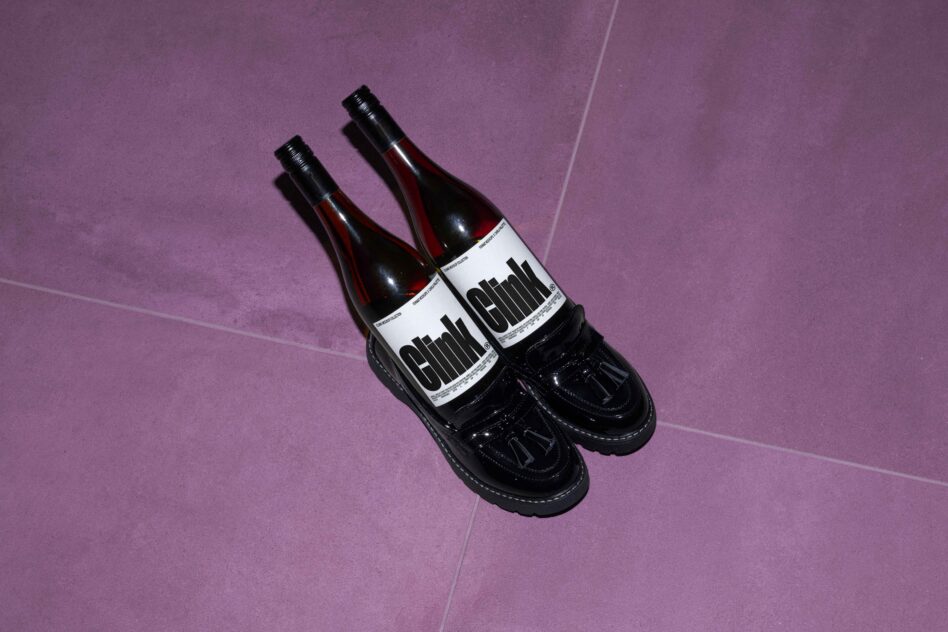 Wine bottle design mockup with bold typography on purple background ideal for branding presentations designer resources creative showcase templates.
