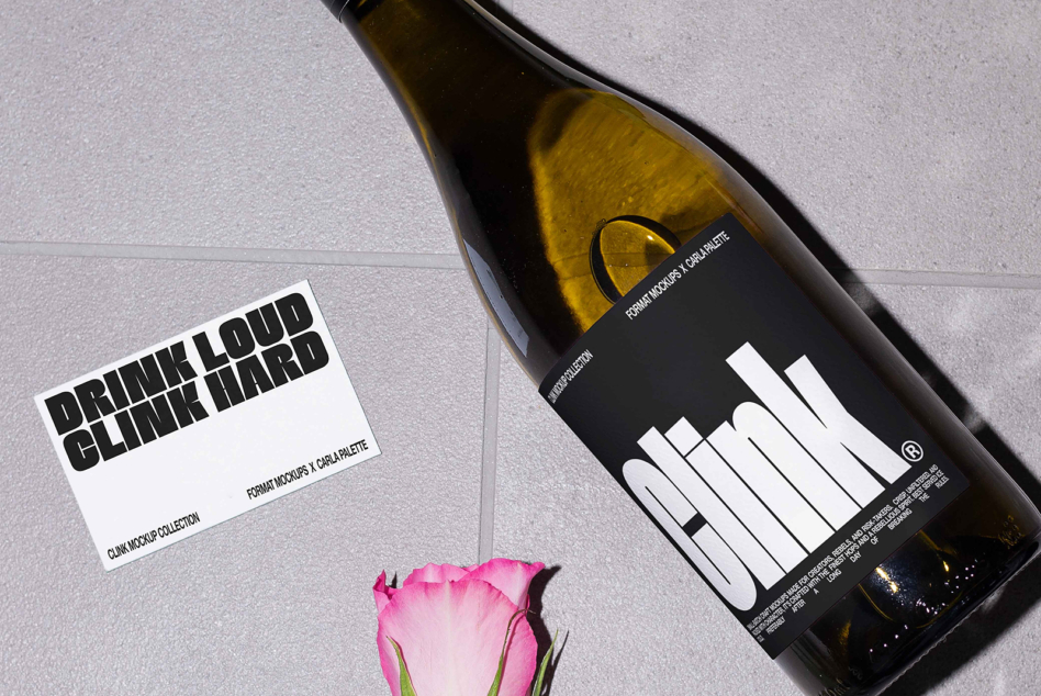 Dark bottle label mockup with white typography, white card, single pink rose on tiles