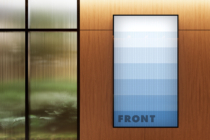 Wood paneled interior with blank frame showing blue gradient labeled FRONT