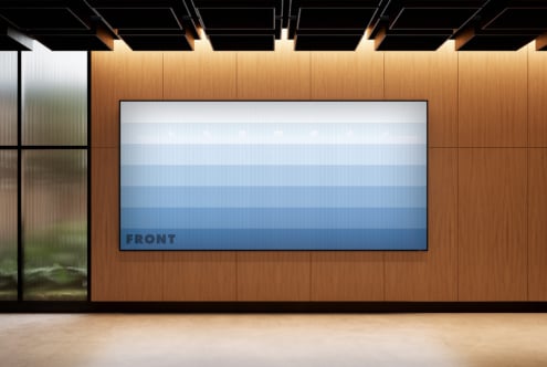 Blue gradient canvas mockup displayed on a wooden wall in modern interior. Ideal for showcasing design templates or graphics in visual presentations.
