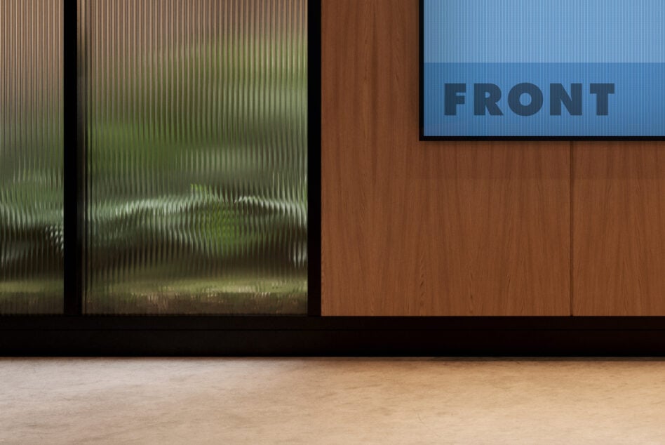 Sleek office wall with frosted window, wood paneling, blue screen mockup