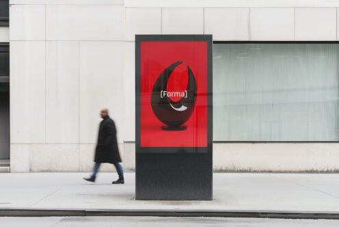 Urban poster mockup featuring a bold red and black abstract design in a city setting ideal for graphic designers and marketers template SEO keywords