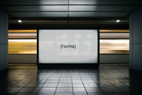 Mockup of an illuminated subway advertisement space showing the word Forma with motion blur of passing train suitable for designers and creatives