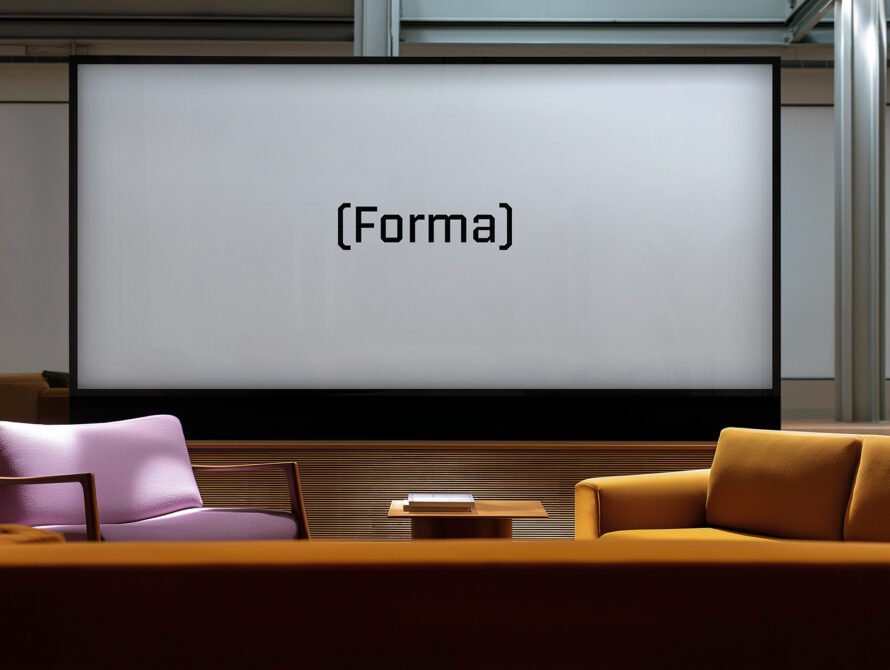 Modern lounge area with two sofas in pastel and mustard hue facing a wooden table, a large screen displays the text Forma. Perfect for font mockups.