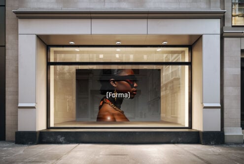 Storefront window mockup featuring a modern design with a large poster of a person in sunglasses and jewelry perfect for branding and advertising visuals