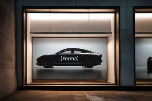 Sleek car silhouette in upscale showroom window perfect for automotive mockups modern design displays and digital product presentations for designers