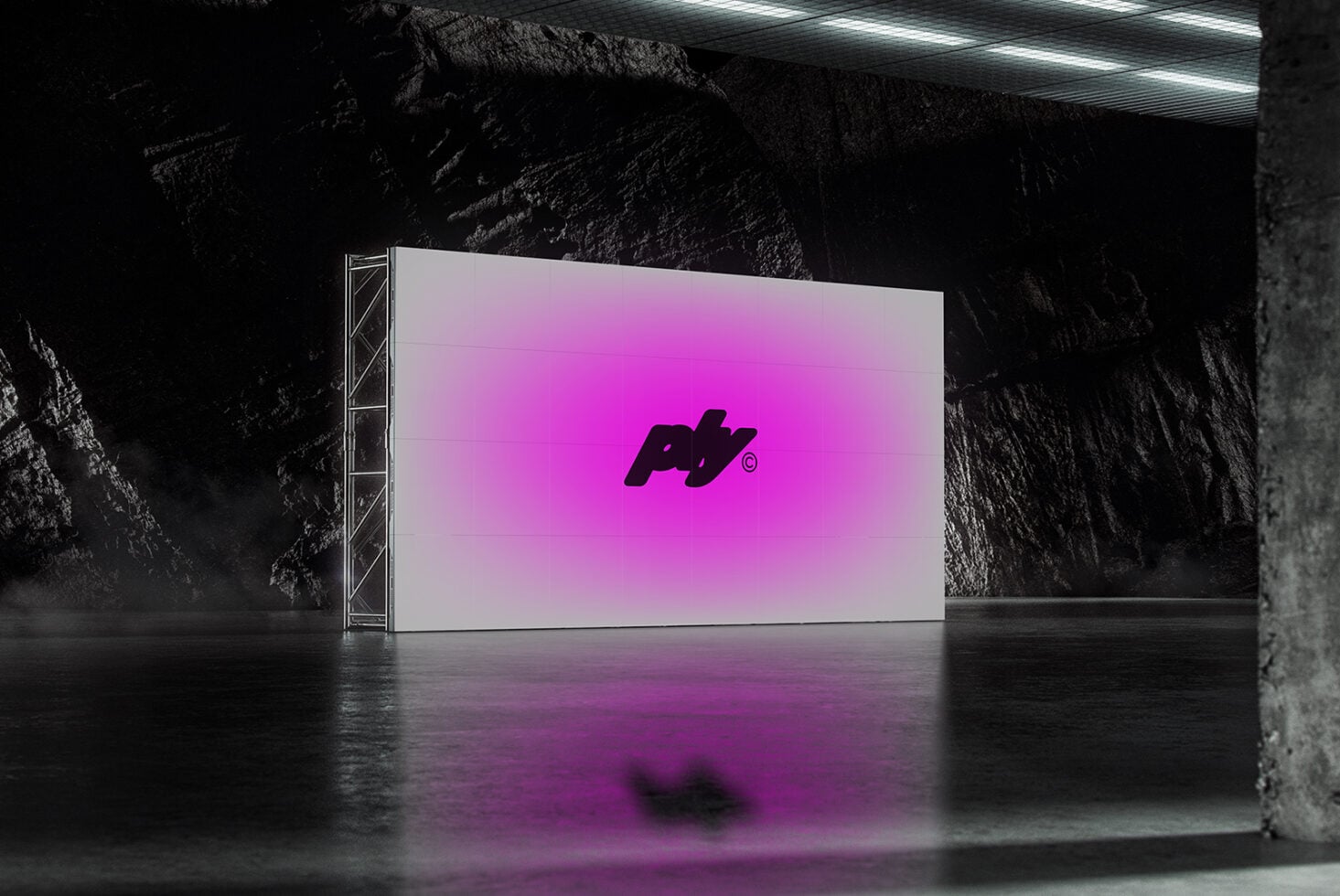 Large screen displaying hot pink gradient logo in raw concrete warehouse space