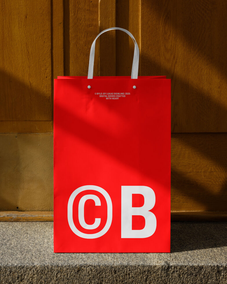 Red shopping bag mockup against wooden wall, featuring bold white C B letters. Ideal for branding design, graphic templates, marketing presentations.