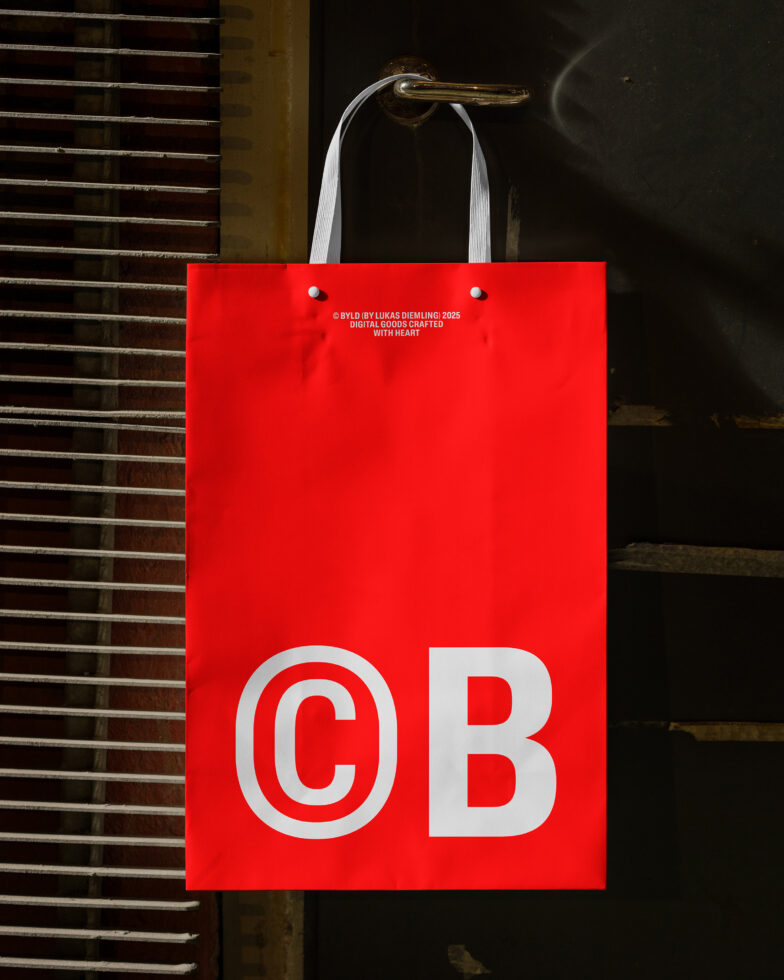 Red shopping bag PSD mockup with bold letters hanging on a door handle, ideal for branding presentation, retail design, and promotional graphics.