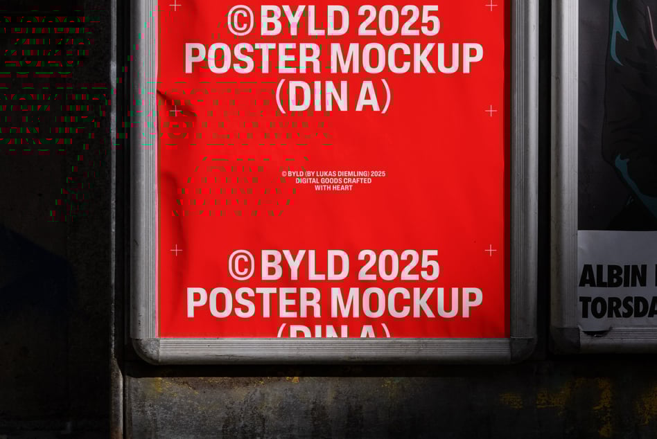 Red vertical poster mockup reading BYLD 2025 in a silver frame on a dark wall perfect for designers seeking high-quality display representations.