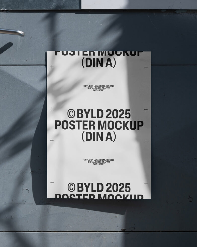 Poster mockup on a grey textured wall with subtle shadows. Ideal for showcasing graphic design projects. Keywords: mockup, template, design asset.