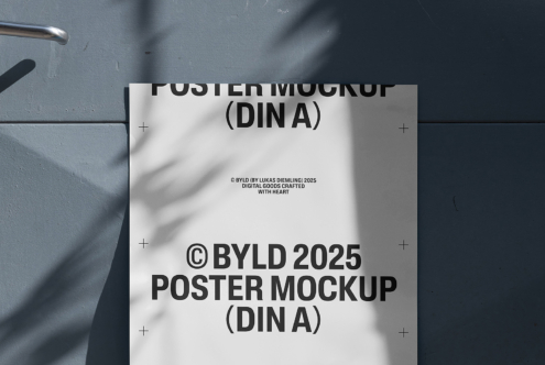 Poster mockup template in DIN A format displayed on a textured wall with shadow overlay. Ideal for showcasing design projects. High-resolution graphics.