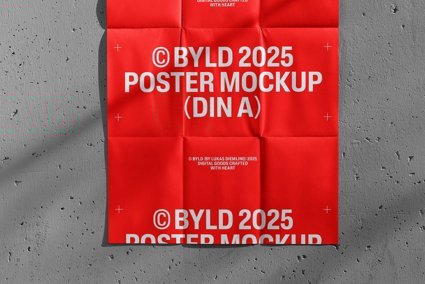 Red folded poster mockup on textured wall displaying the text BYLD 2025 DIN A poster design ideal for graphic designers and digital assets.