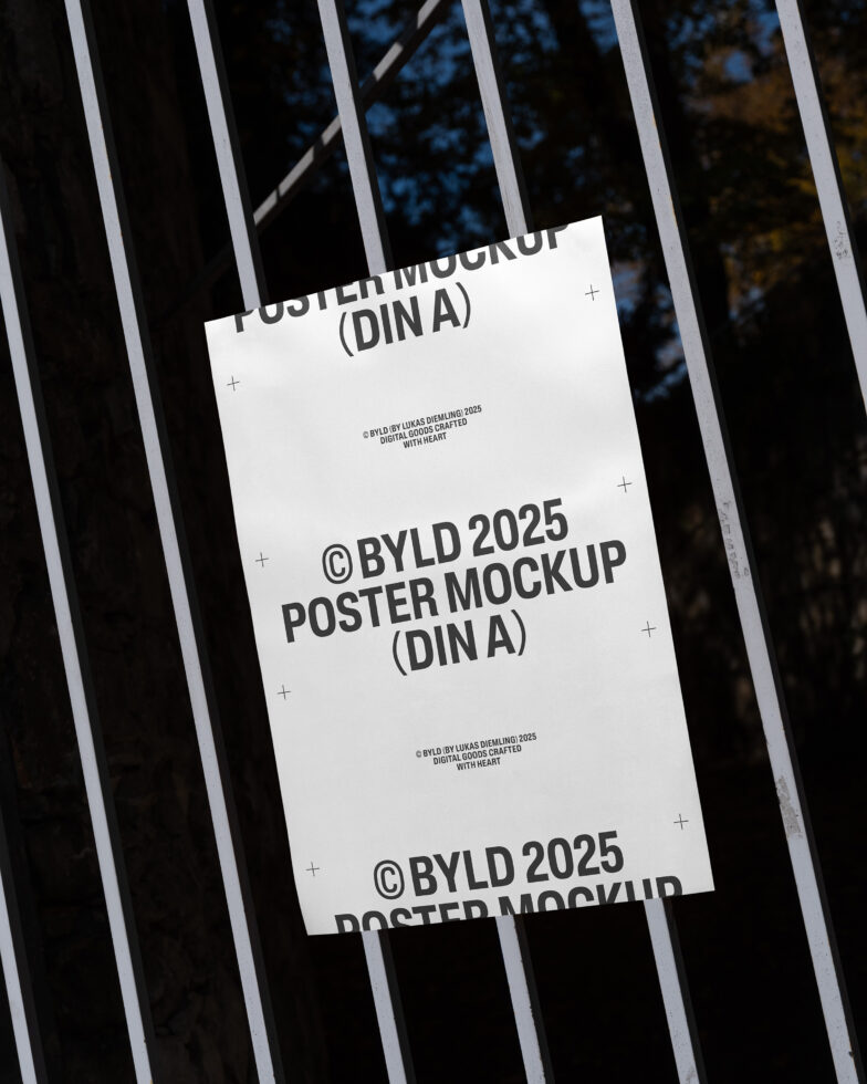 Poster mockup with a blank sheet on a metal fence background. Ideal for showcasing graphic designs, templates, or artwork in outdoor settings.