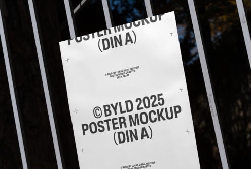 Mockup of a poster on a metal fence showcasing a BYLD 2025 design. Ideal for designers looking for realistic display templates. SEO keywords: poster mockup DIN A template design.