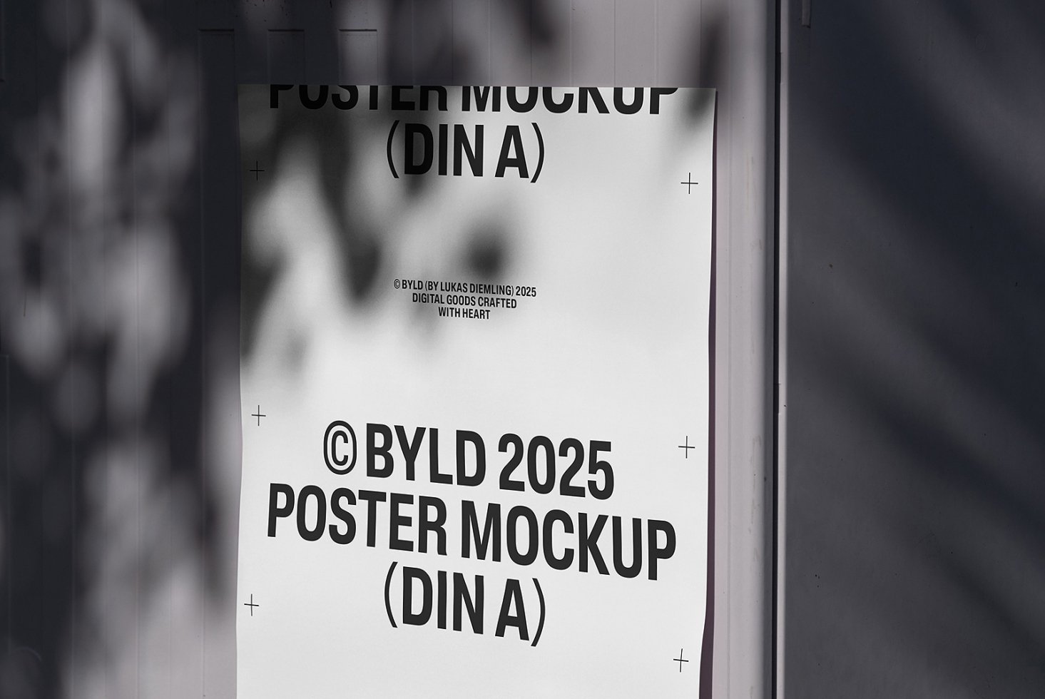 Minimalist poster mockup on a wall with shadows. Suitable for showcasing designs. Keywords: poster, mockup, template, graphics, design tool.