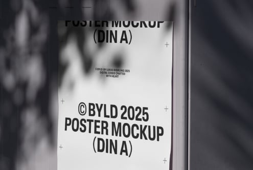 Minimalist poster mockup on a wall with shadows. Suitable for showcasing designs. Keywords: poster, mockup, template, graphics, design tool.