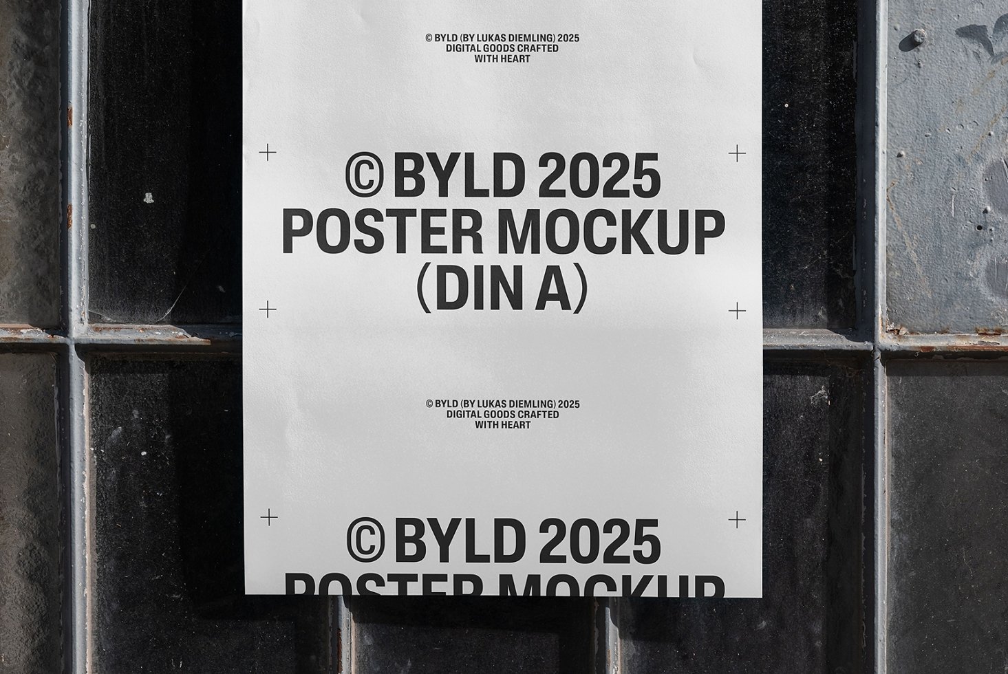 Poster mockup template showing blank paper against a textured wall. Ideal for showcasing design work. Keywords: poster, mockup, template, design.
