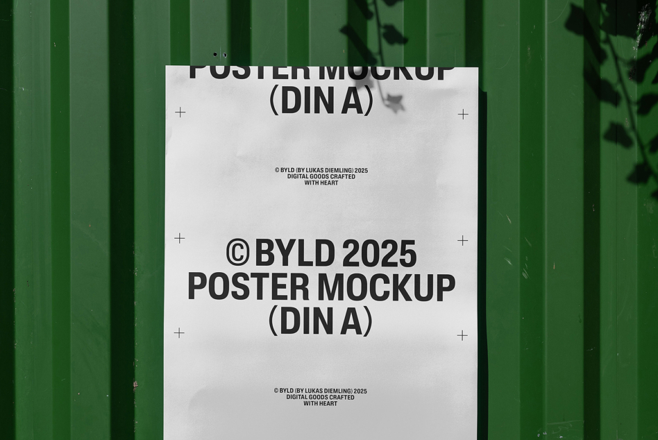 White DIN A poster mockup on green corrugated metal wall with shadow overlay