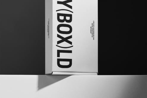 Minimalist packaging mockup featuring a sleek black and white box on a contrasting background perfect for showcasing branding design concepts.