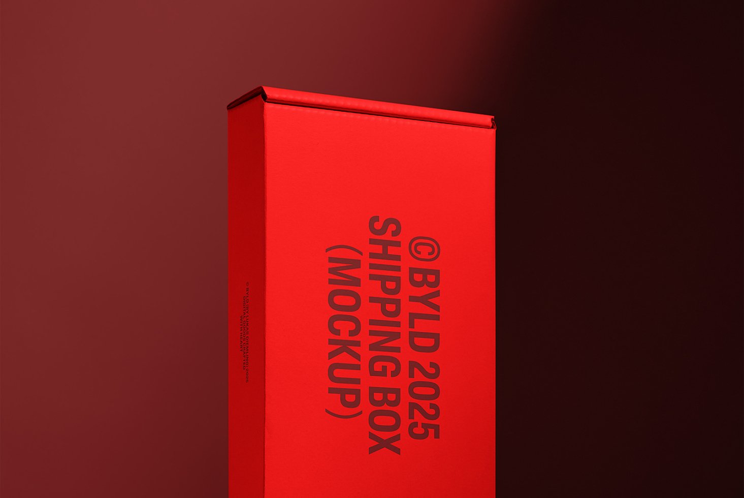 Red shipping box mockup with bold black text against a gradient brown background. Ideal for designers seeking realistic packaging presentation.