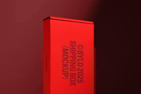 Red shipping box mockup with bold black text against a gradient brown background. Ideal for designers seeking realistic packaging presentation.