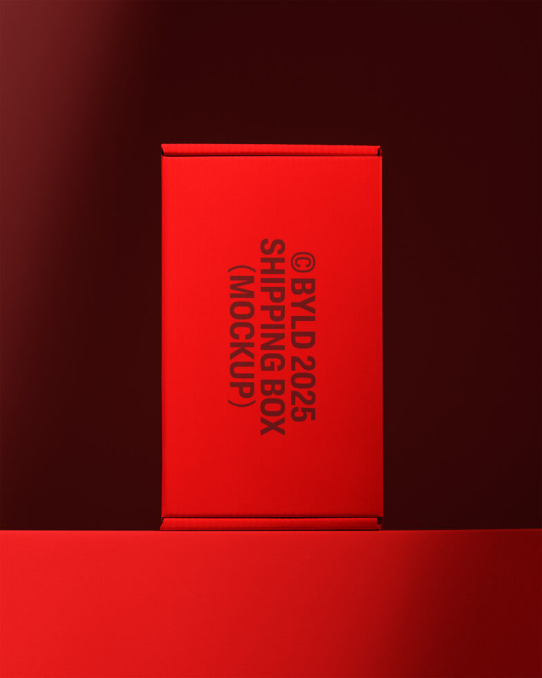 Red shipping box mockup with bold typography on a dark background. Perfect for showcasing design projects. Keywords: mockup, design, template, box.