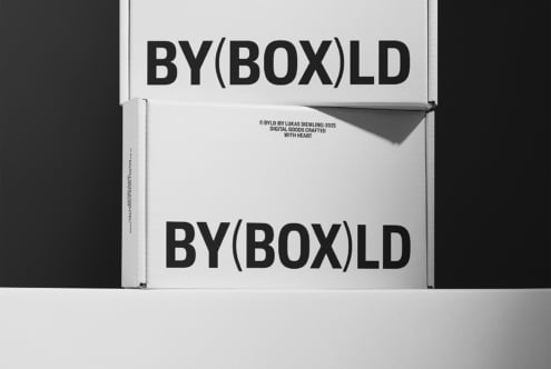 Two stacked white boxes with bold black lettering reading BYBOXLD on a grayscale background. Ideal for packaging mockup, branding design, or template use.