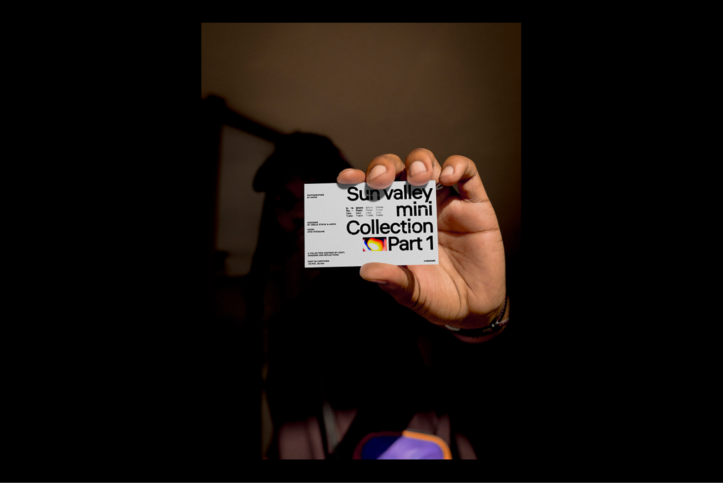 Person holds a business card with bold typography Sun Valley Mini Collection Part 1 suitable for designers. Ideal for mockup template and font projects.