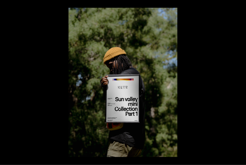 Designer in nature holding a poster mockup titled Sun Valley Mini Collection Part 1 showcasing modern graphic design layout for templates and creatives.