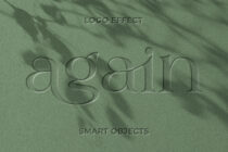 Engraved script text reading egsaito on wrinkled sage green fabric