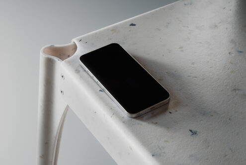 Smartphone on a modern speckled white table. Mockup ideal for showcasing app designs UI UX templates. Perfect resource for design professionals.