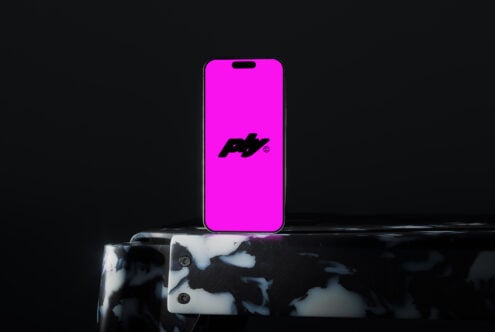 Smartphone mockup on dark marble table with pink screen. Ideal for digital designs. Perfect for designers seeking modern device mockups for branding.