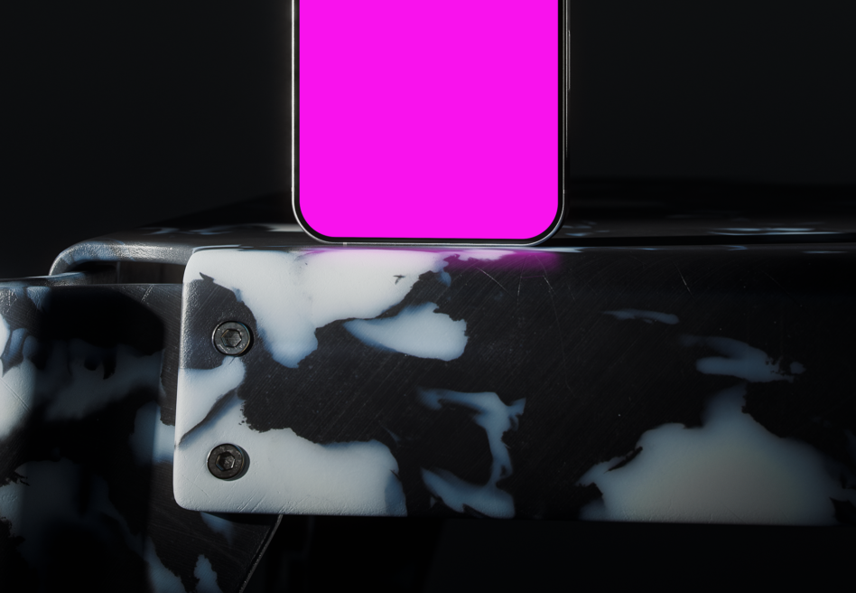 Smartphone with bright magenta screen resting on textured white case against dark background