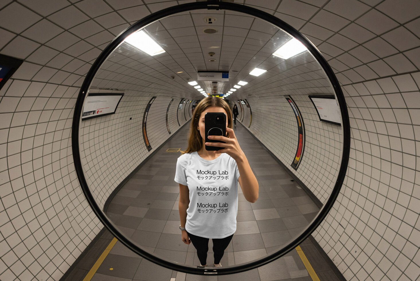 Mockup template image showing a person in a subway mirror wearing a t-shirt with text Mockup Lab ideal for graphic designers and digital asset creators.
