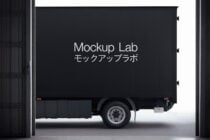 Blank black delivery truck side panel mockup in garage space