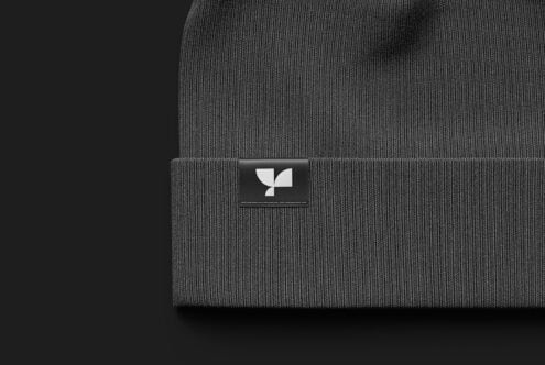 Gray ribbed beanie mockup featuring a minimalist logo on the front. Ideal for branding design projects apparel templates fashion graphics digital assets.