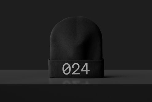Black beanie mockup with minimal design featuring number 024 on the fold. Ideal for fashion templates and branding in graphic design projects.