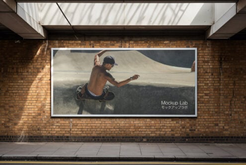 Urban mockup showcasing a skateboarding scene on a large billboard. Brick wall background. Ideal for designers seeking realistic presentation assets.