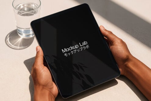 Tablet mockup in hands with modern design, ideal for digital projects and presentations. Perfect for designers seeking high-quality graphic resources.