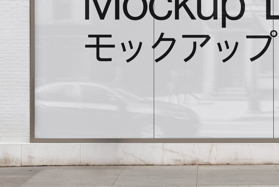 Storefront window display with Japanese text on white glass panels